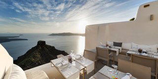 At this modern Cycladic boutique hotel in the village of Imerovigli, you can enjoy breathtaking views of Santorini’s majestic caldera from the pool, your bedroom, or the resort’s fine dining restaurant. 