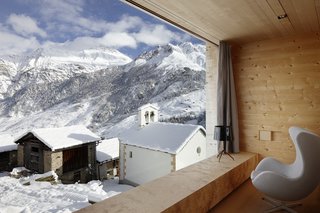 7 Alpine Holiday Chalets in Switzerland - Photo 3 of 7 - Located in the Graubünden region of the Swiss mountains, this vacation property designed by Swiss architect Peter Zumthor is a modern reinterpretation of the traditional timber houses found in the area of Leis.