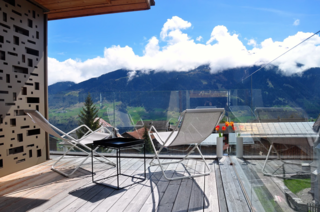 7 Alpine Holiday Chalets in Switzerland - Photo 5 of 7 - Situated in the alpine village of Vignongn, with views of the Val Lumneziz (Valley of Light), this eco-friendly, Scandi-inspired vacation home has a sunny terrace where you can enjoy views.