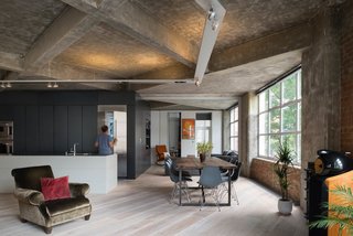 A concrete ceiling highlights the powerful geometry of this 2,583-square-foot Clerkenwell apartment by London practice Inside Out Architecture.