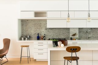 Sited in the heart of the Barnsbury Conservation Area, in the middle of a row of Georgian houses, the apartments of Barnsbury Square Lofts bring the steel and glass sleekness of modern architecture into a historic London neighborhood.