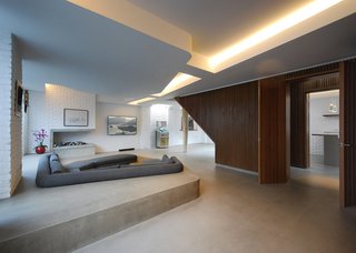 On a site surrounded by Victorian homes in Primrose Hill, Patalab Architecture transformed a former mechanic’s garage into a three-bedroom house and two one-bedroom apartments.