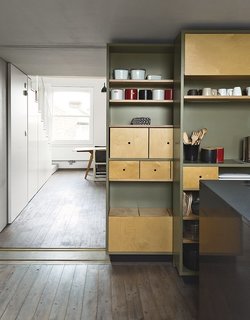 Architects Silvia Ullmayer and Allan Sylvester helped reinvent metalworker Simone ten Hompel’s 576-square-foot flat with a retractable skylight and smart storage systems.