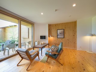 7 Modern Japanese Hotels That Will Help You Find Your Zen - Photo 5 of 7 - In Minami-Uonuma—just two hours away from Tokyo by train—Sotoyama Jujo is a countryside hotel with cypress-and-cedar wood floors, an outdoor bathtub, stunning mountain views, and furniture by Arne Jacobsen, Hans Wegner, and Isamu Noguchi.