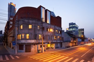 12 Modern Hotels in Historic Buildings Around the World - Photo 11 of 24 - Housed within an old warehouse that was used during the Japanese occupation of China, this minimalist, riverside boutique hotel has white-and-blonde wood walls and clean-lined furniture that give the guest rooms a Scandinavian, loft-like feel. 