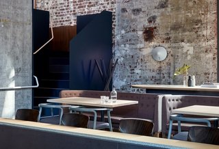 10 Modern Structures That Use Brick in Interesting Ways - Photo 10 of 10 - When this old power station in Melbourne was restored and transformed into a chic, six-level restaurant, the raw brick and concrete structure of the original building was preserved. The weathered look of the brick walls serve as a dramatic backdrop to the fashionable, contemporary furniture that inhabits the space.