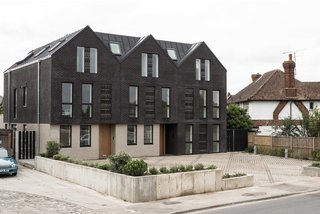 6 Best Dwell UK Apartments - Photo 2 of 7 - Located on the site of demolished old bungalows, Haddo Yard in Whitstable now consists of seven newly built apartments developed by Arrant Land and designed by celebrated UK practice Denizen Works. The building's facade has dark brick gables that echo the black timber sea fronts of fishing huts found in this part of Kent. 