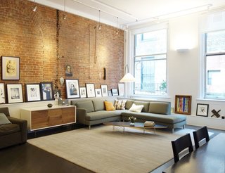 Experience New York City's Eclectic Side at One of These Modern Short-Term Rentals - Photo 5 of 11 - This stunning 1,700-square-foot loft apartment in Tribeca has a master bedroom with an en-suite marble-filled bathroom and large walk-in shower. Plus, the open living room is decked out with plenty of interesting artwork.