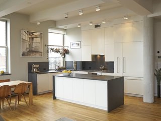 Experience New York City's Eclectic Side at One of These Modern Short-Term Rentals - Photo 7 of 11 - Fitted with 11 massive windows that overlook both Brooklyn and Manhattan, this three-bedroom loft has a fully-equipped gourmet kitchen, which makes it a great choice if you're planning on doing lots of cooking and eating in.