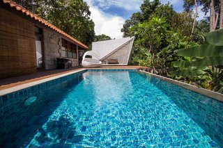 7 Incredible Island Villas in Indonesia - Photo 2 of 7 - Inspired by Indonesian arts and crafts with a thoroughly modern twist, this eco-friendly resort has two types of villas. Both come with their own private pool, forest views, and warm, earth-toned decor.