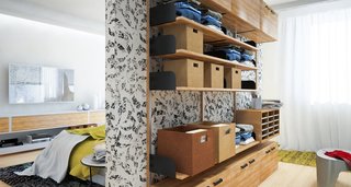4 Decluttering Tips From Organizing Master Marie Kondo - Photo 1 of 4 - Neatly folded clothes are placed in storage baskets and shelves on this doorless wardrobe system in a small bedroom.