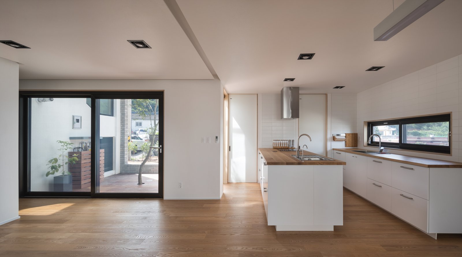 The kitchen and door that opens to a courtyard.