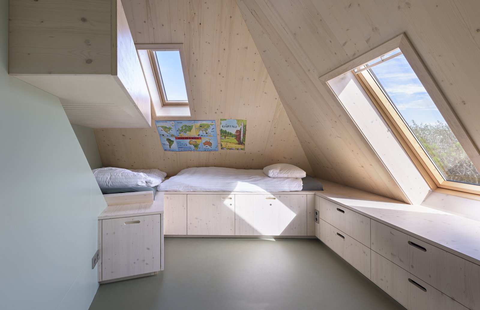 Bunk beds and built-in storage in the attic.
