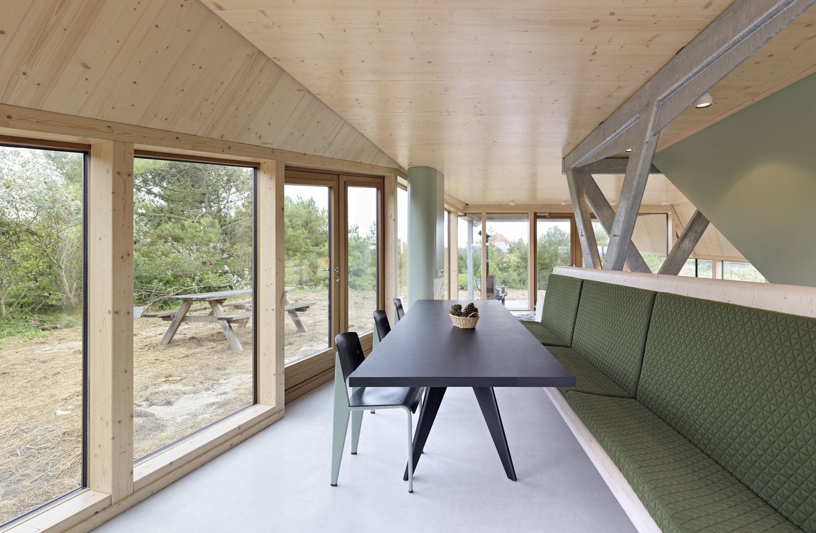 A dining table and bench that can accommodate the large family who use the summer home.