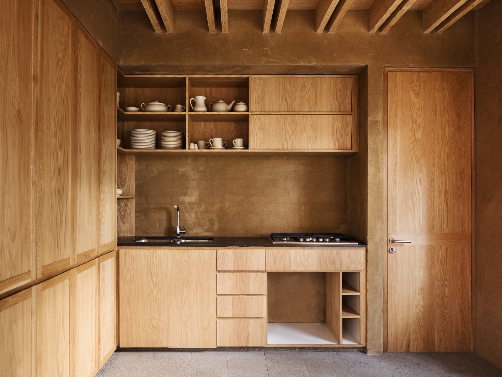 A simple wood-finished kitchen.
