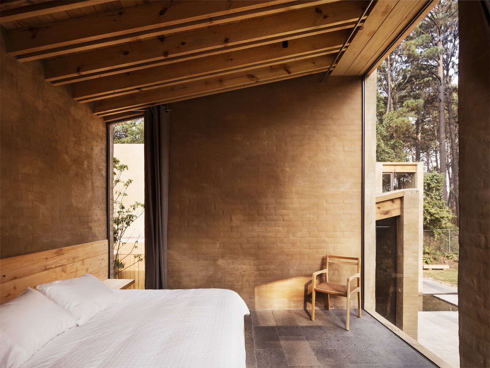A sun-drenched bedroom on the ground level.
