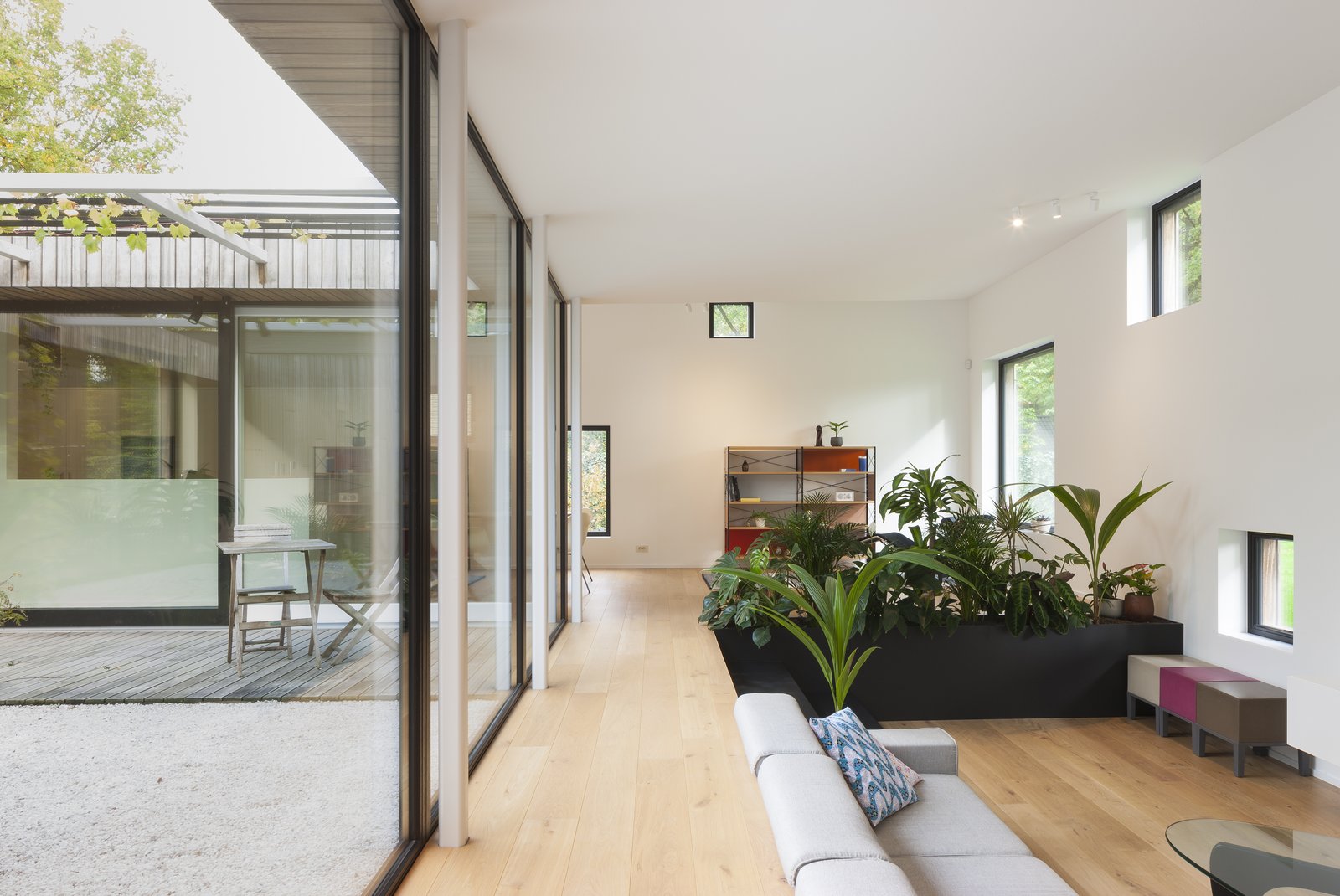 A completely glazed inner courtyard ensures that the home is flooded with light.