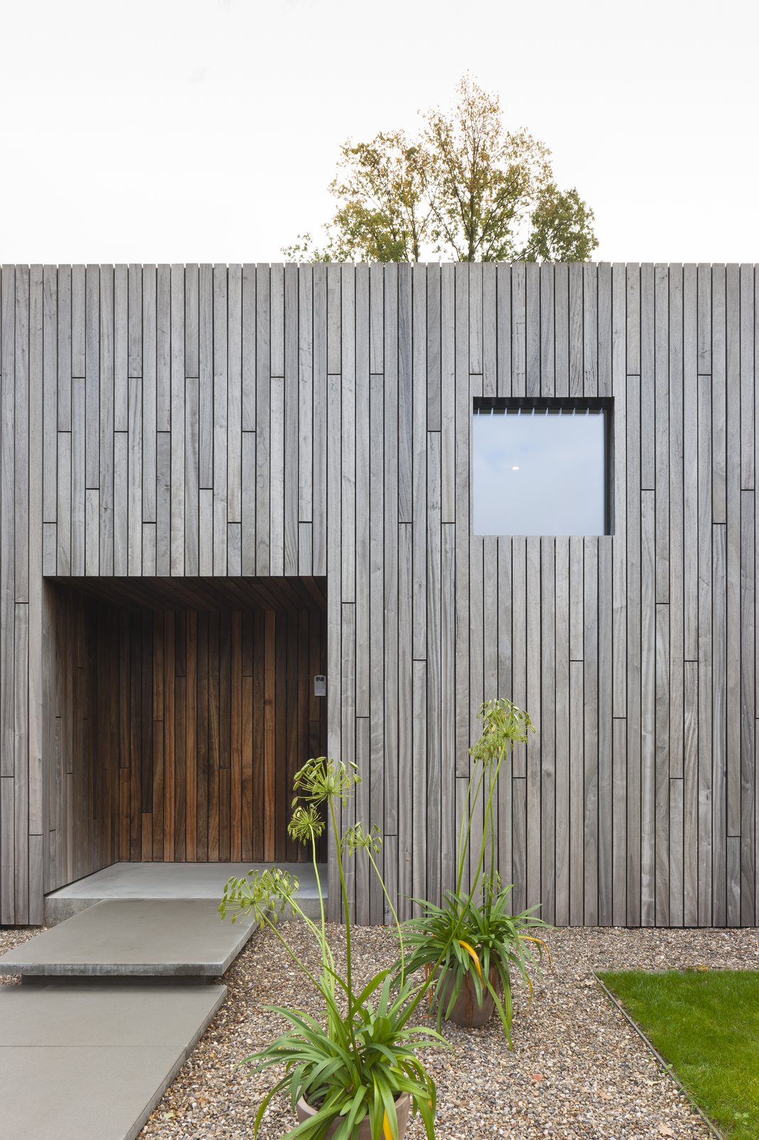 Like the windows, the front door is also a square.