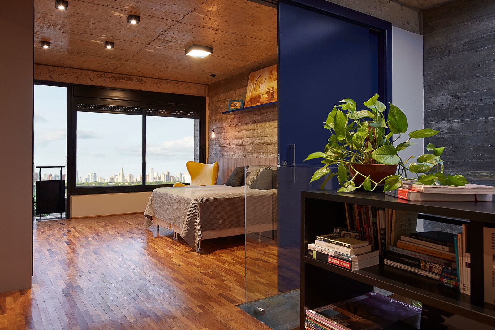 The master bedroom looks out to city views.
