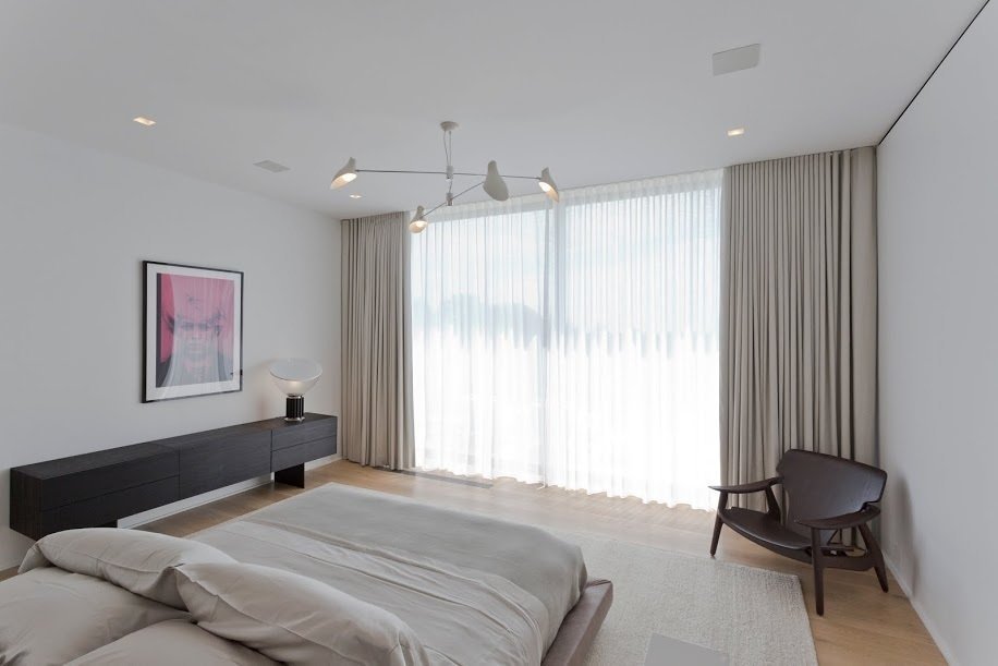 The chandelier in one of the bedrooms is by David Weeks.