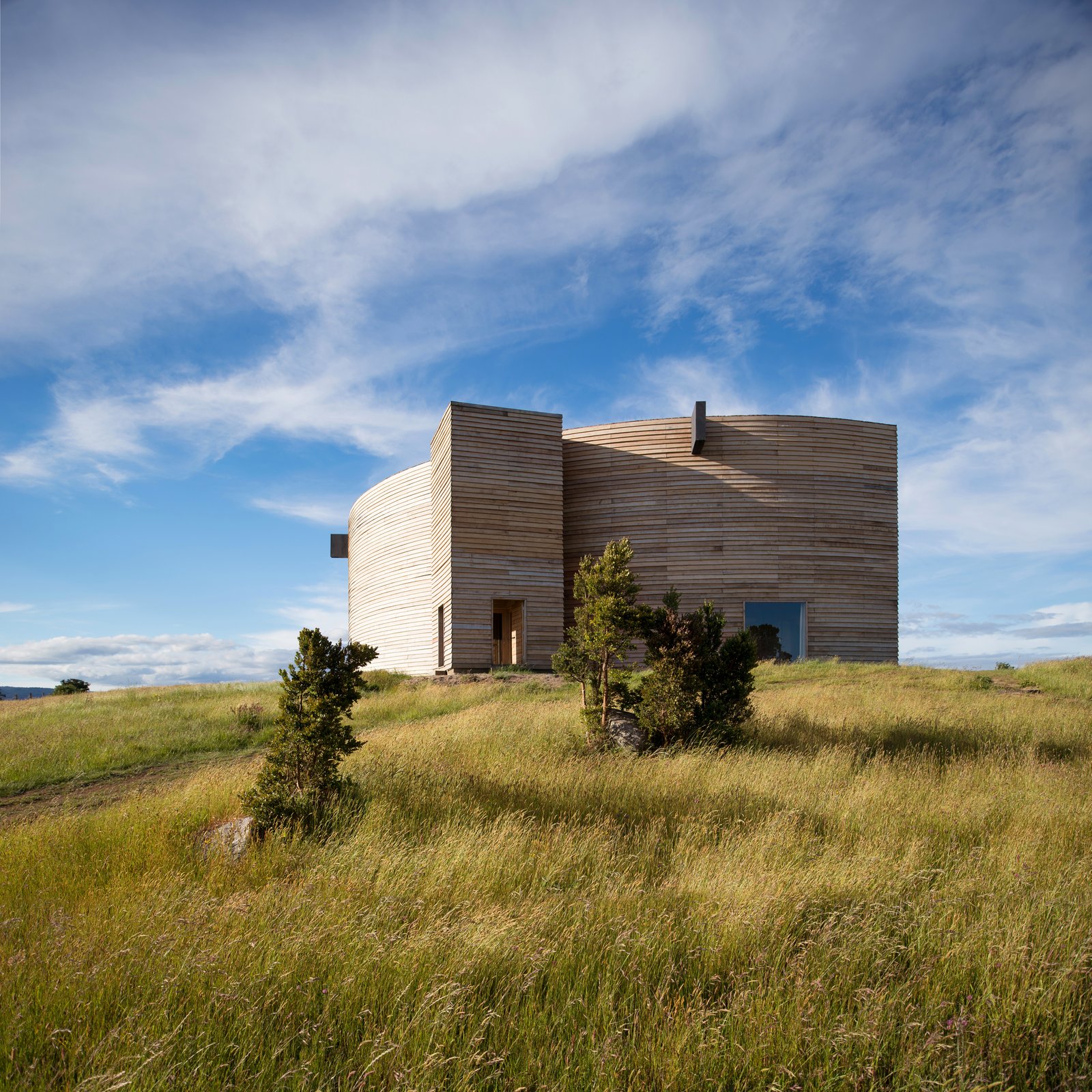 This by Chilean practice Pezo von Ellrichshausen Arquitectos is built with local timber, with 45 rigid frames set in a fan-shaped configuration.