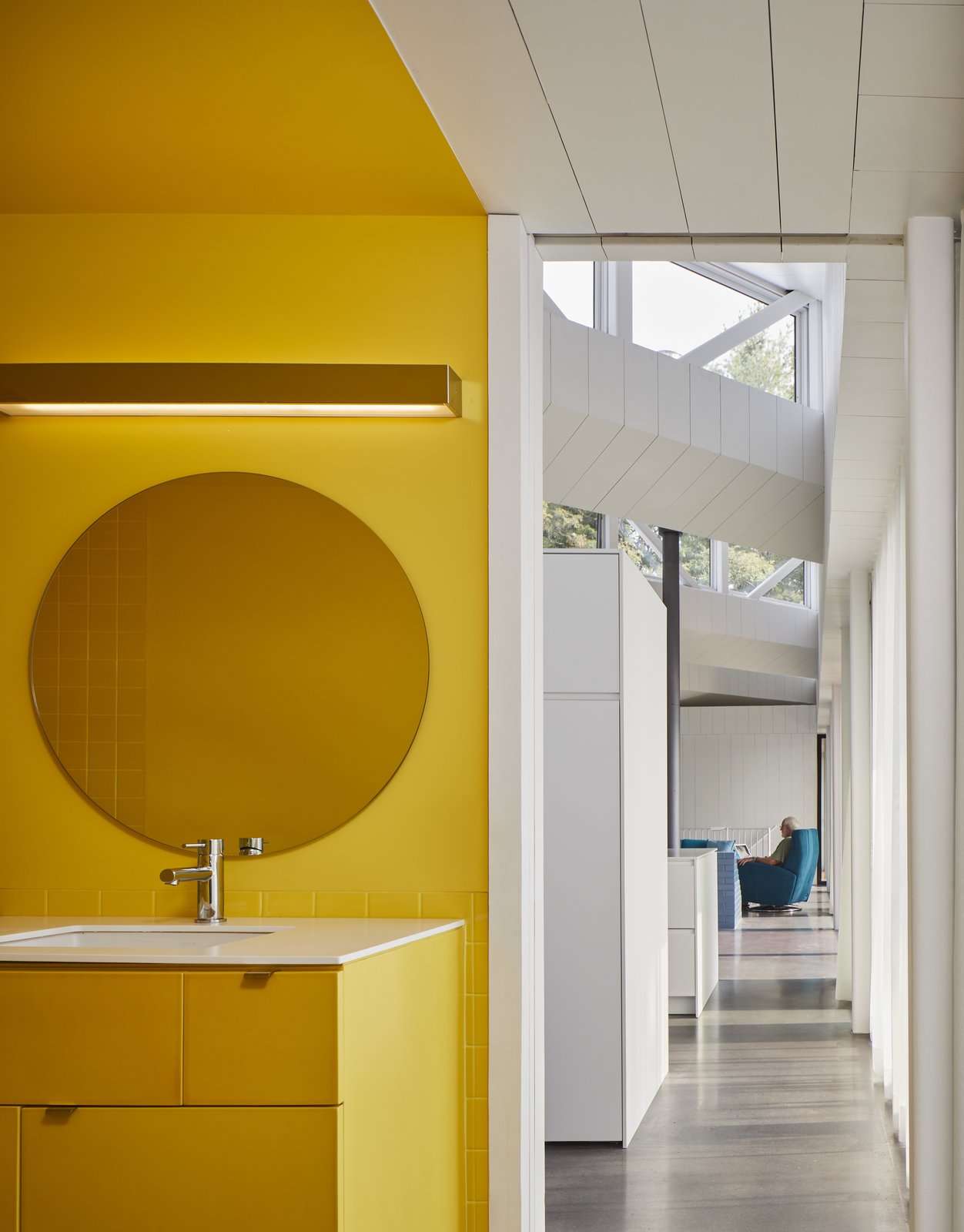 A cheerful yellow bathroom.