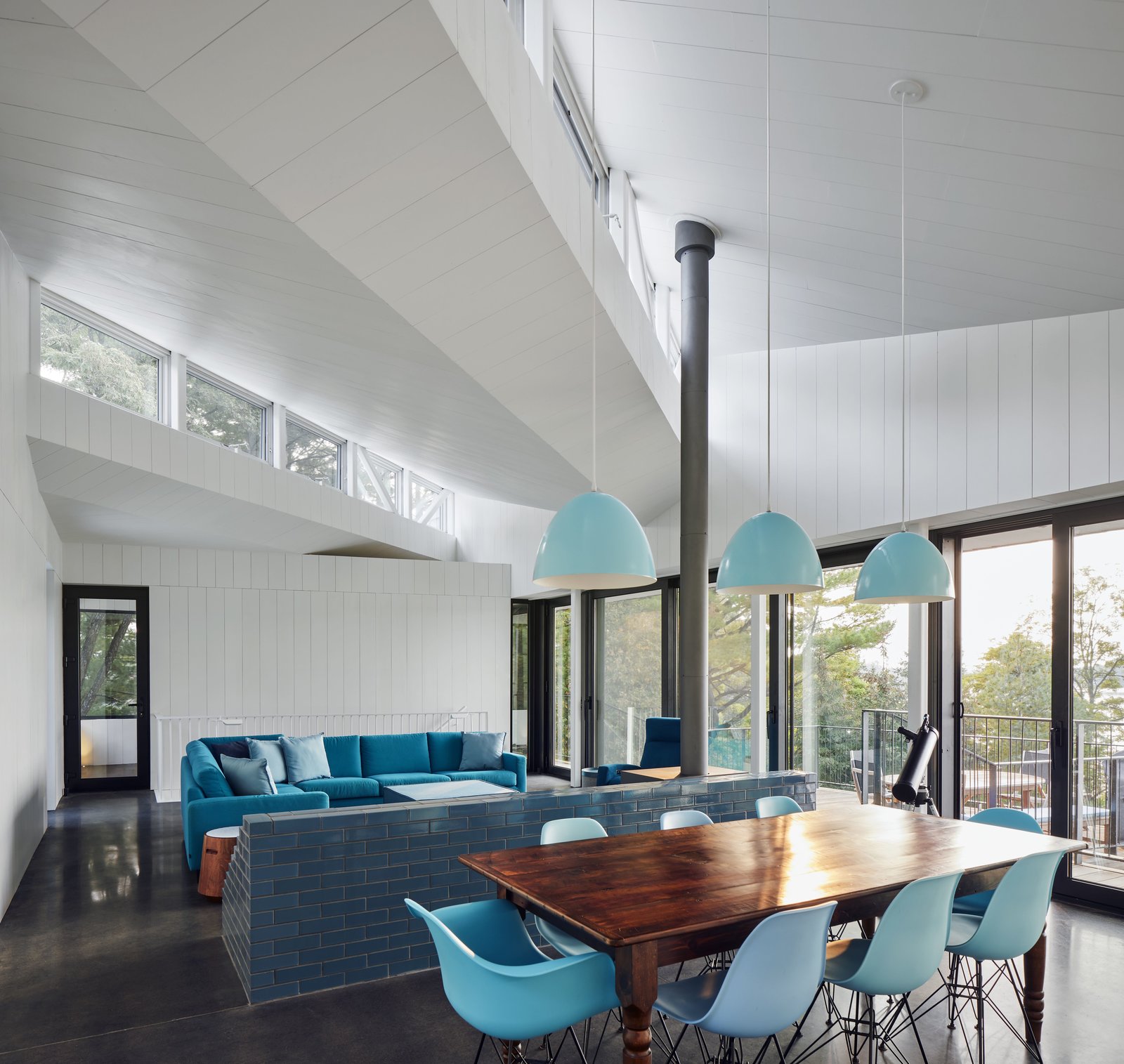 The living room has a cheerful, blue and white color scheme.