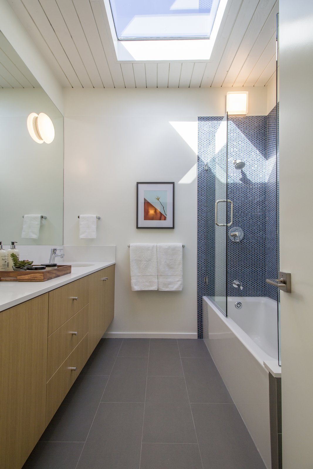 A skylight brightens one of the new bathrooms.