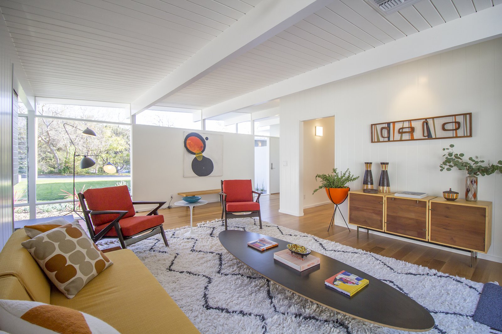 A lounging den with bright pops of color.