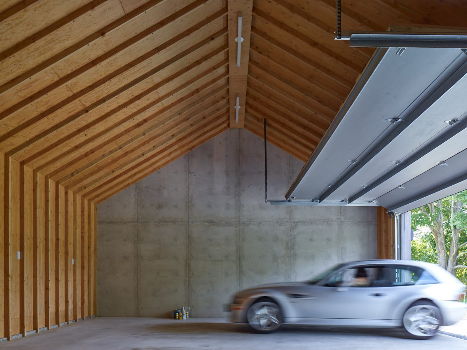 The garage behind the concrete wall.