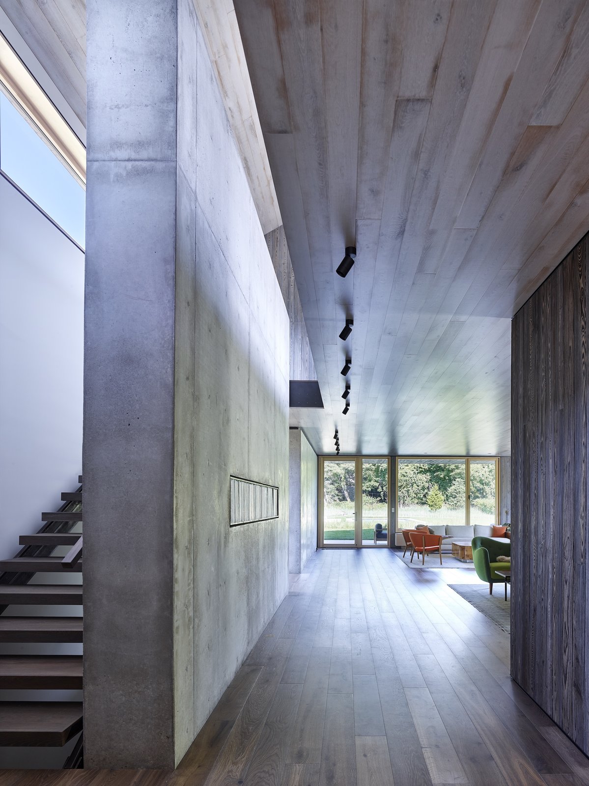 The rich textural contrast between concrete and wood on the façade, is repeated with the interiors.