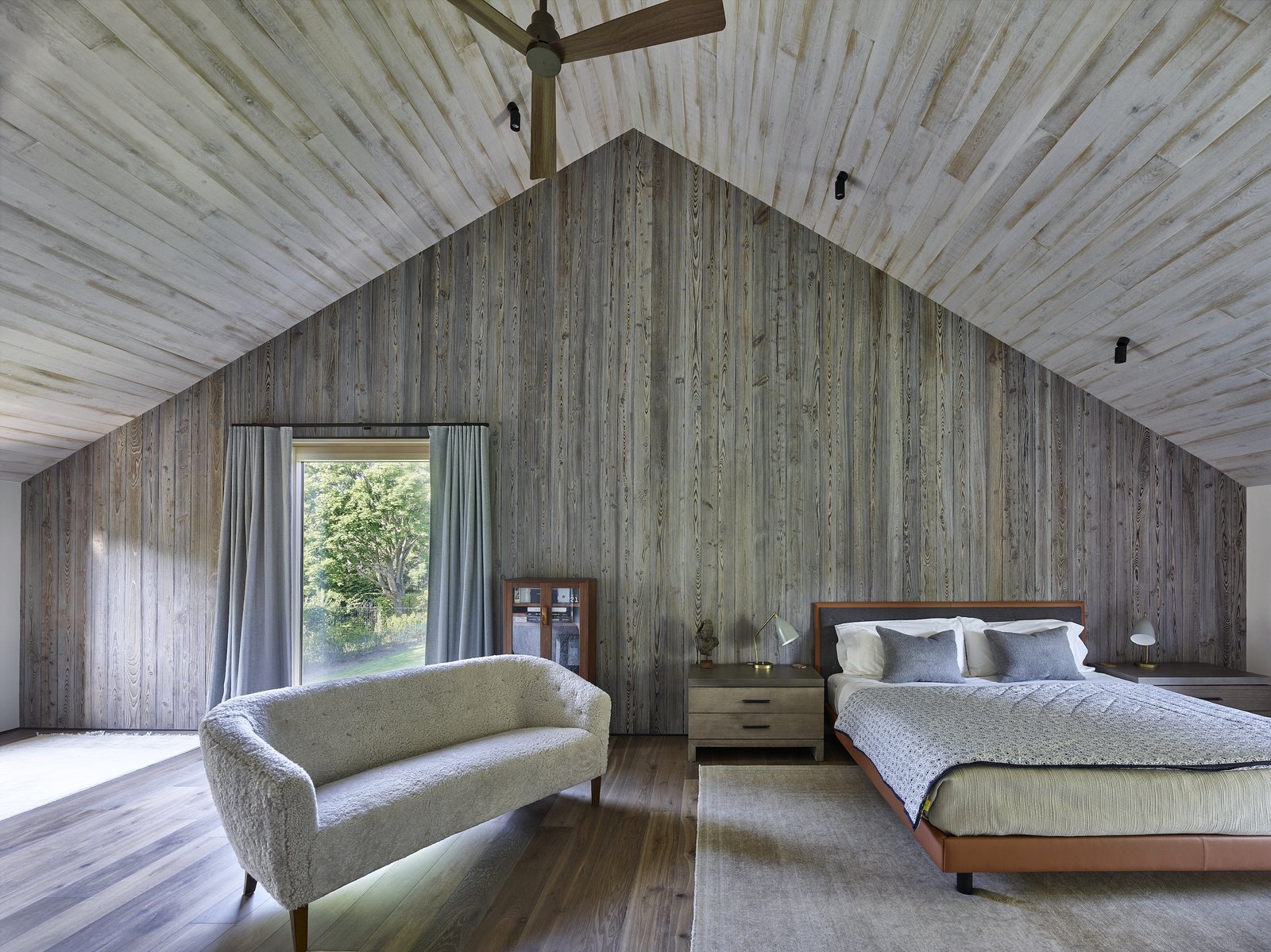 A porch and roof “cut-out” separates the parent’s bedroom on one end from the two children’s bedrooms on the opposite ends.