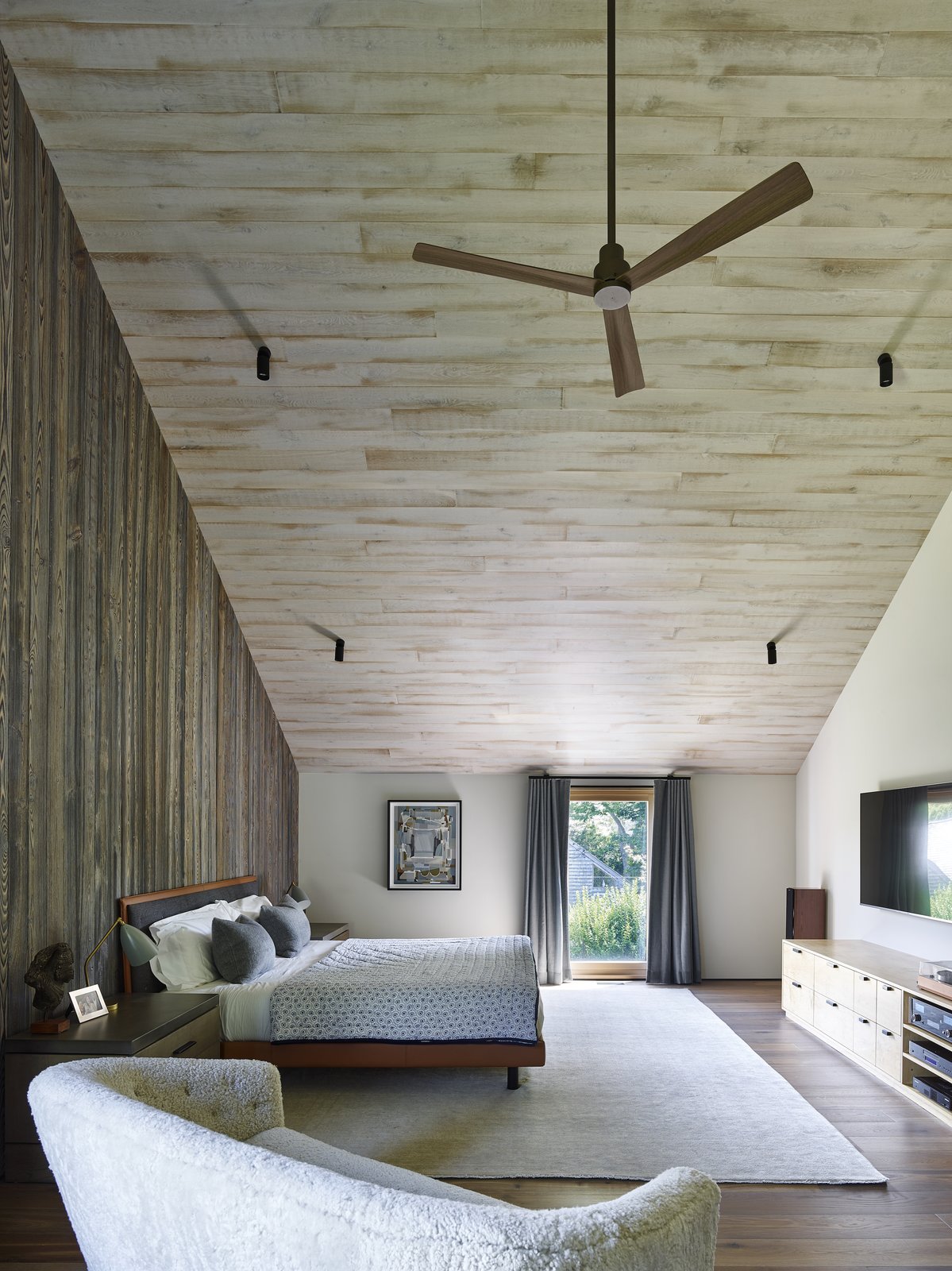 The parent's bedroom is located at one end of the top floor.