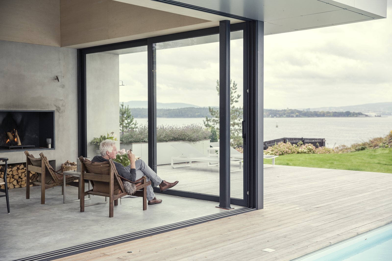 A cozy fireplace and unobstructed sea views makes this additional living lounge a great place for relaxing contemplation.