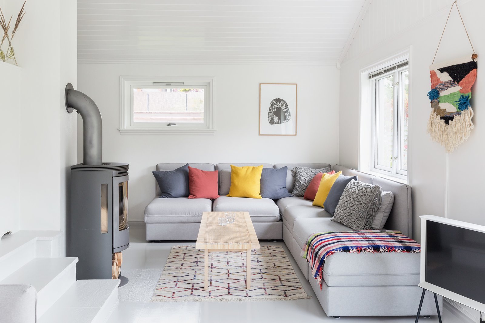 A wood-burning fireplace keeps the second living lounge warm in winter.
