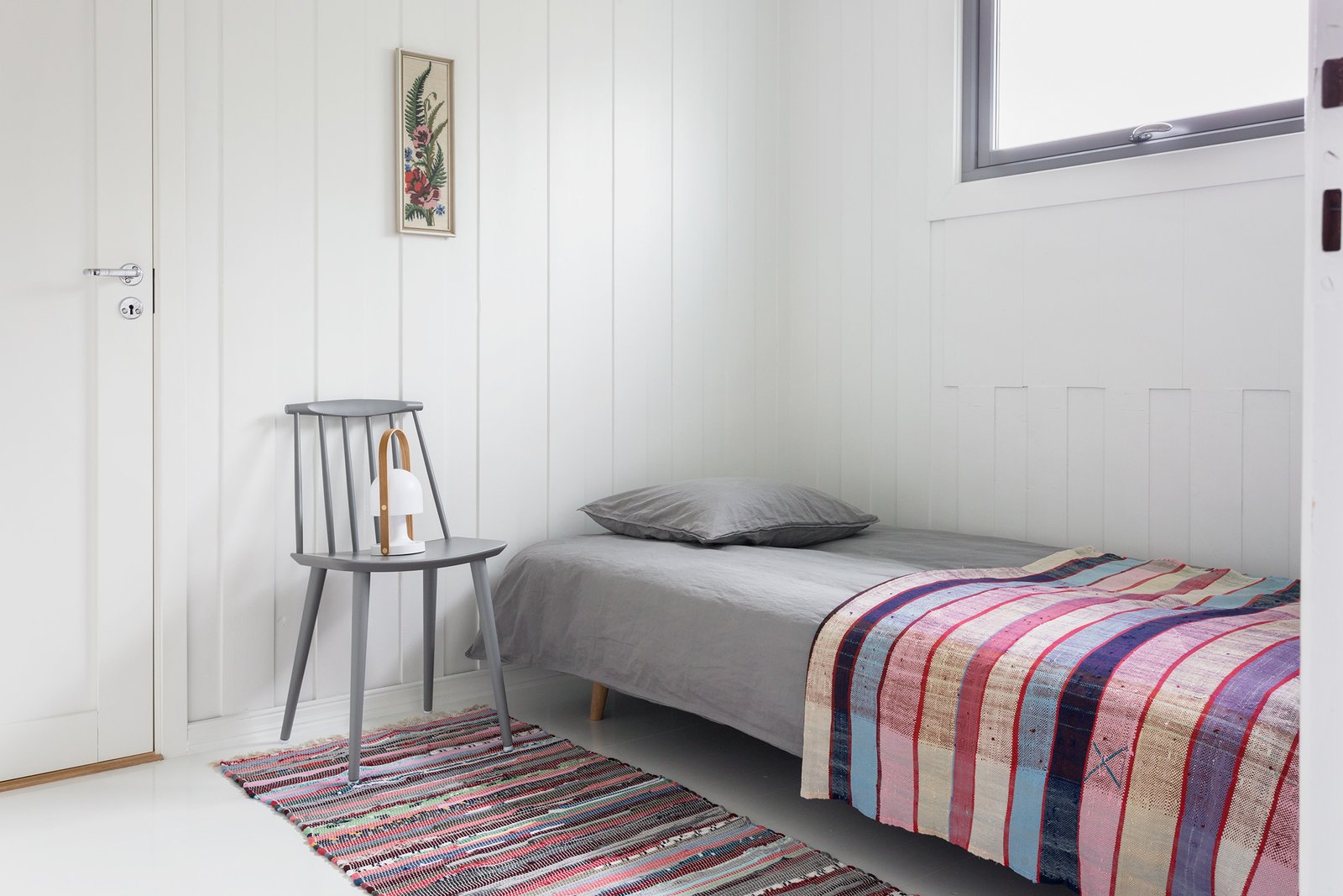 A transit room with a sofa bed.