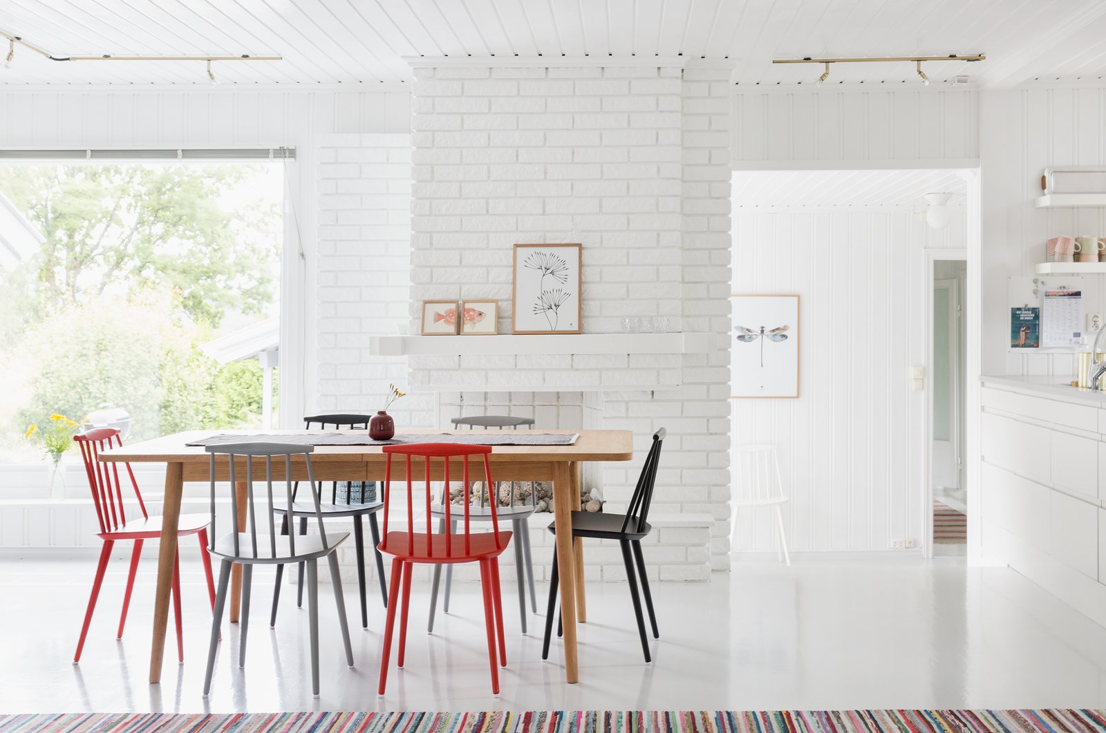 Large picture windows bring much sunlight into the dining area.