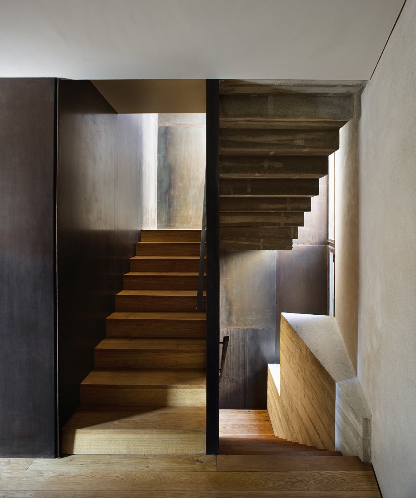 The staircase that leads from the ground-level apartment to the duplex.