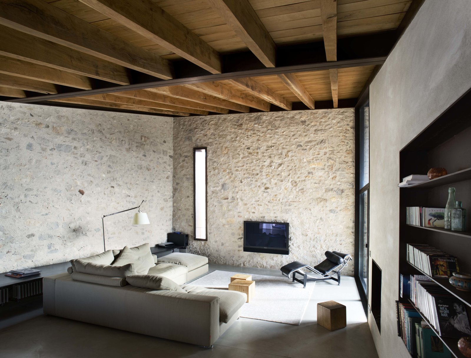 Contemporary materials like concrete and steel are a wonderful contrast to the ancient stone walls.