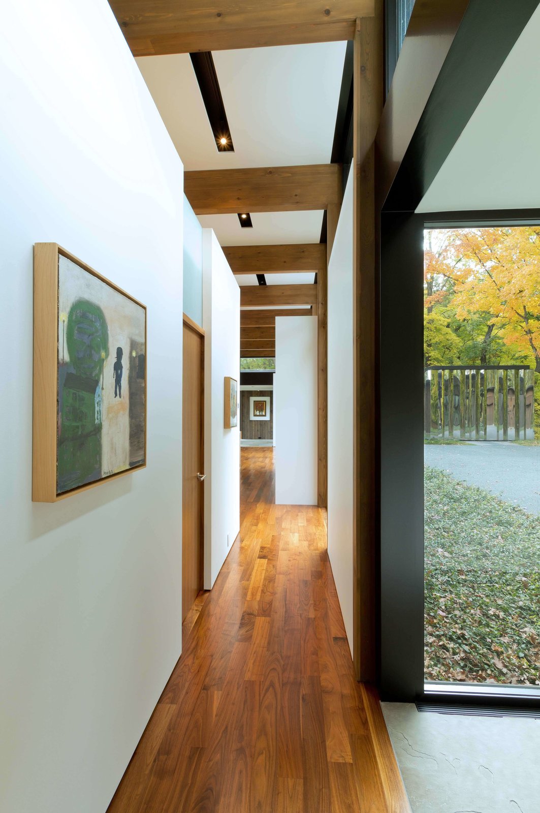 Art work along the walls of the hallway that connect the wings.