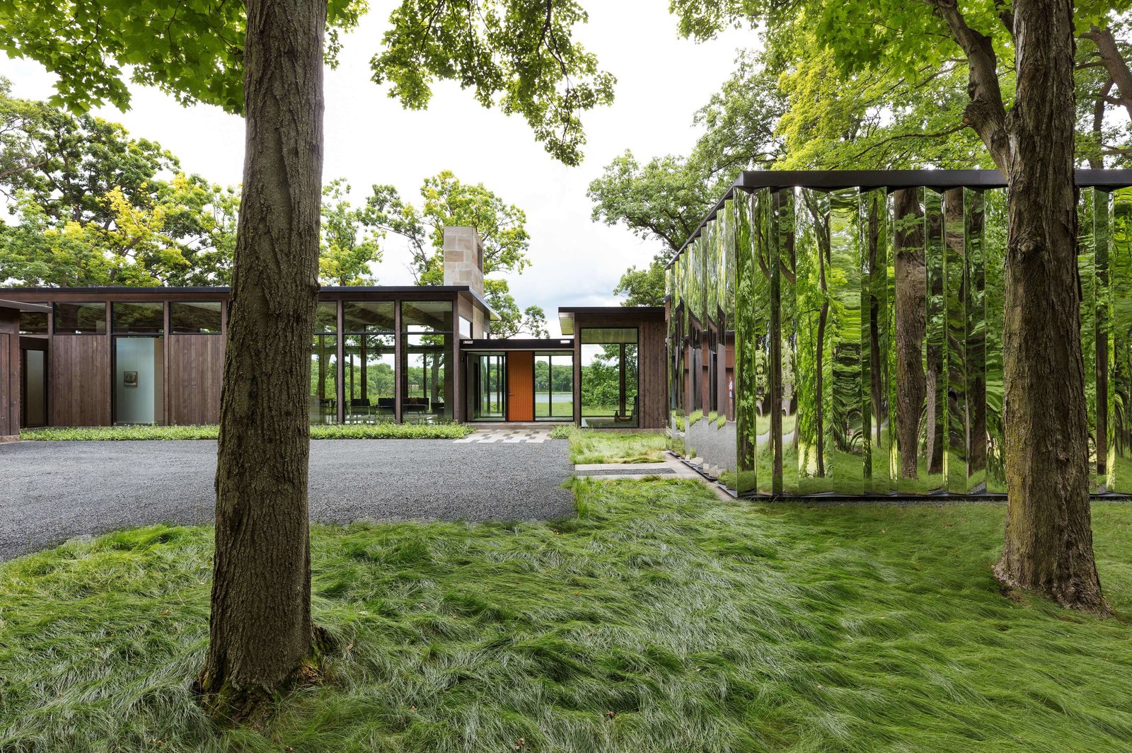 The mirror-clad shed gives the property a sense of constant movement.