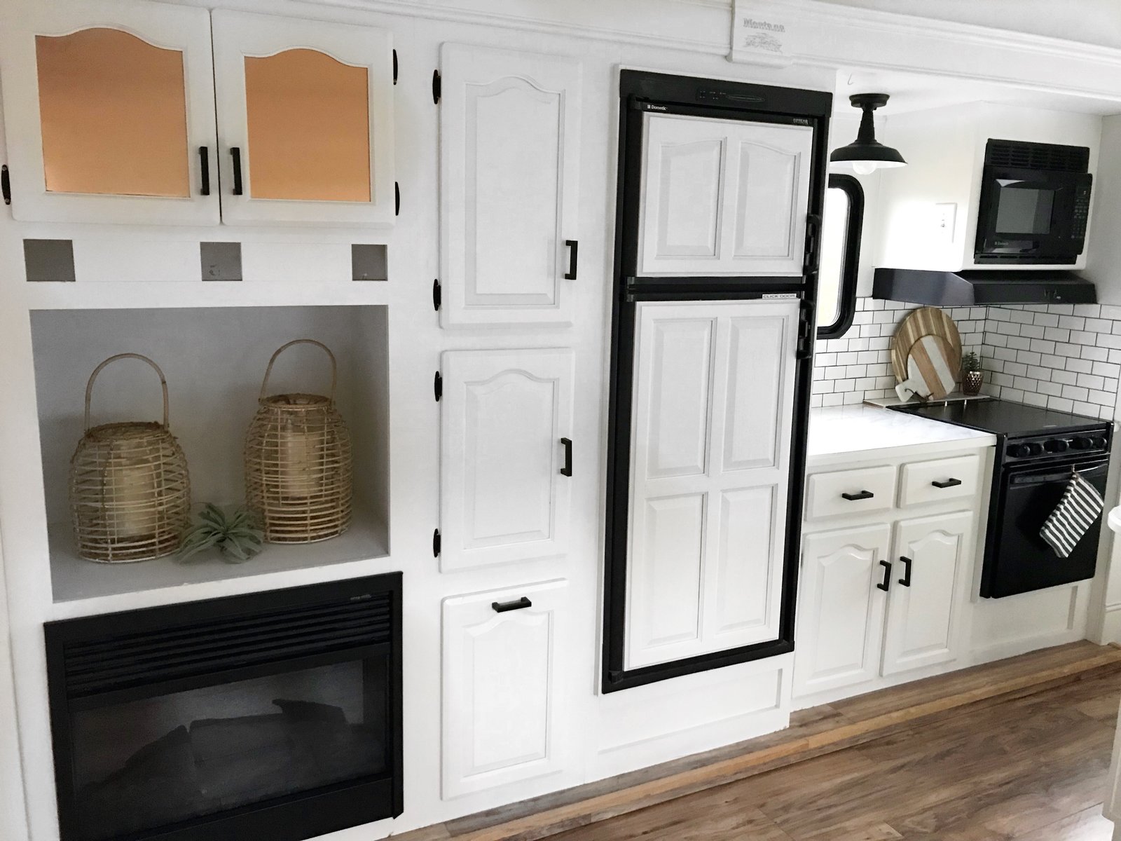 The kitchen has a fireplace, oven, microwave, electric cooktop and plenty of discreet storage.