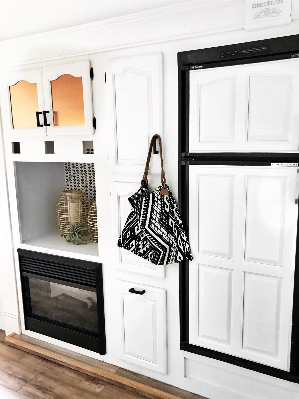 Clean white cabinetry blends in with the walls.
