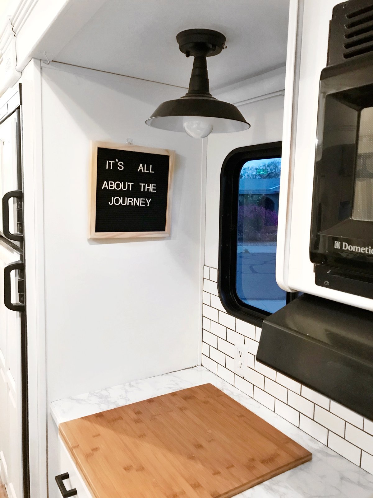 The kitchen workstation faces a window.
