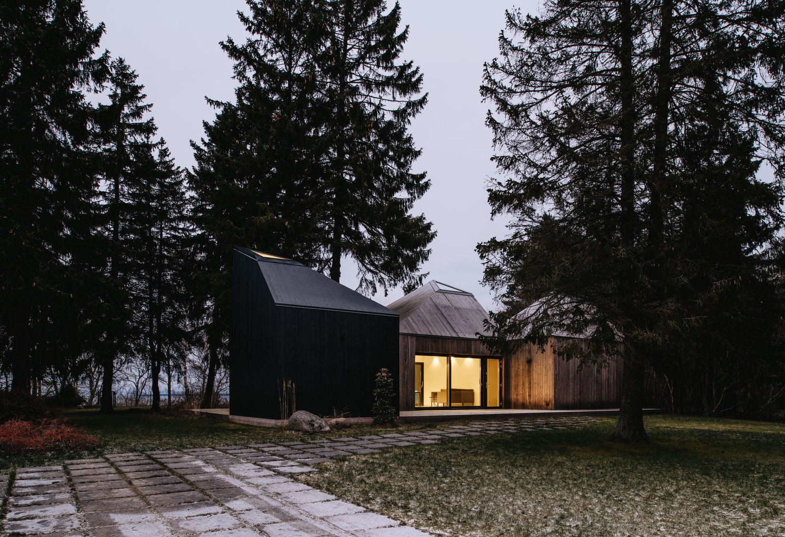 The three cabins have north-facing windows that frame views of the Baltic Sea.