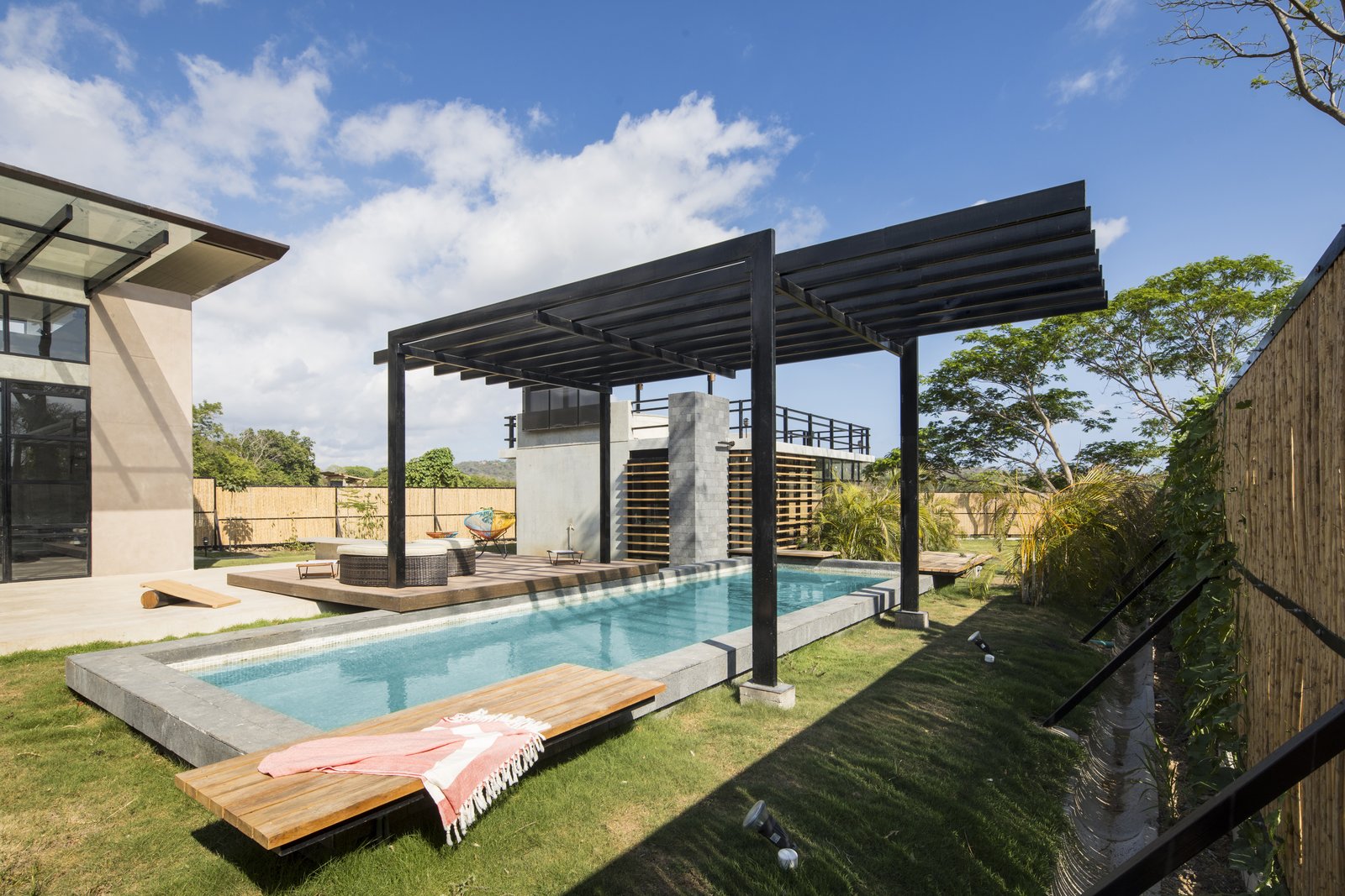 A pergola keeps swimmers cool on hot days.