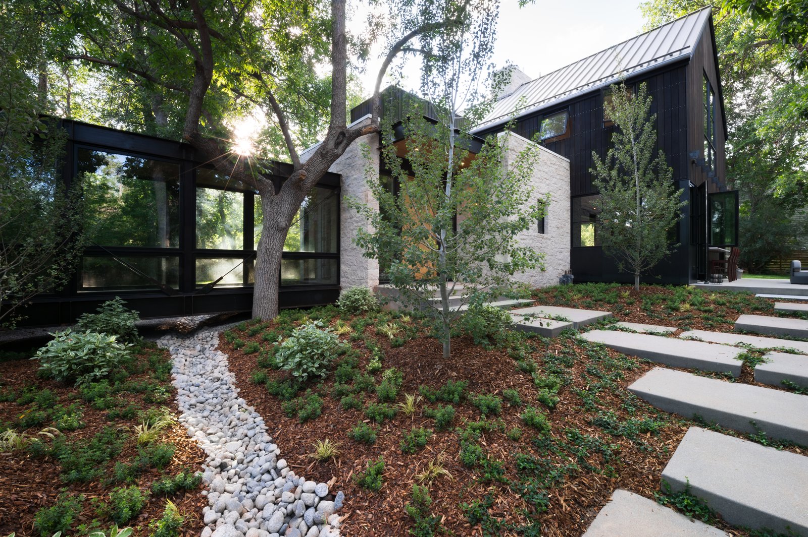 The home features a beautiful garden, designed and landscaped by Marpa.