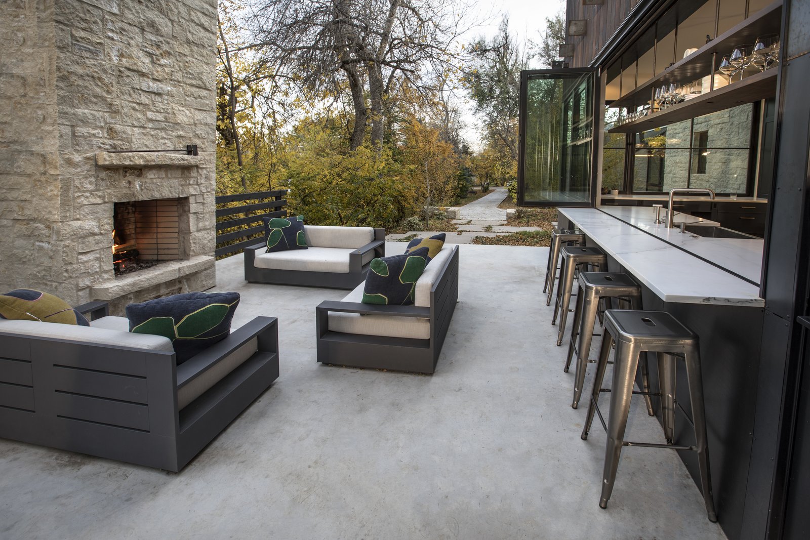 The kitchen bar counter extends out to the patio, creating a great space for entertaining.