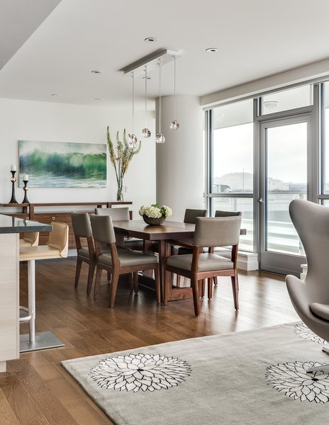 Modern home with dining room, ceiling lighting, chair, medium hardwood floor, table, pendant lighting, carpet floor, and recessed lighting. Custom walnut wood dining table and chairs by Altura Furniture, chairs in Christian Liagre leather, credenza by Knowlton Brothers thru A. Rudin and bar stools DWR. Custom glass Mizu pendant from Terzani in Italy and mecho solar shades throughout. Madeline Weinrib custom wool and silk rug from Nepal. Encaustic painting by Bay Area artist Thea Schrack. Walls in Benjamin Moore Color of the Year 2016 Simply White OC-117.
Bronze candlesticks by Corbin Bronze and brass bowl by Cecil Humphreys thru Sloan Miaysato. Photo 2 of Arden Mission Bay Contemporary Condo