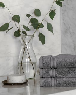 How to Prepare Your Bathroom for Overnight Guests - Photo 2 of 8 - Dedicate a few complete sets of Parachute’s Classic Towels for guests’ use only; Source: Nicole LaMotte/Parachute